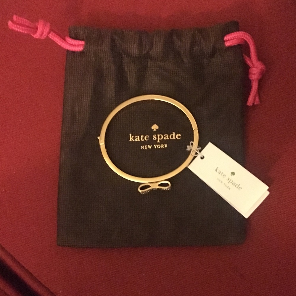 Kate Spade gold bracelet with silver studded bow